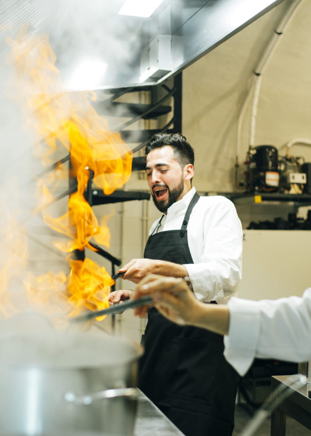 The cook making a flambe